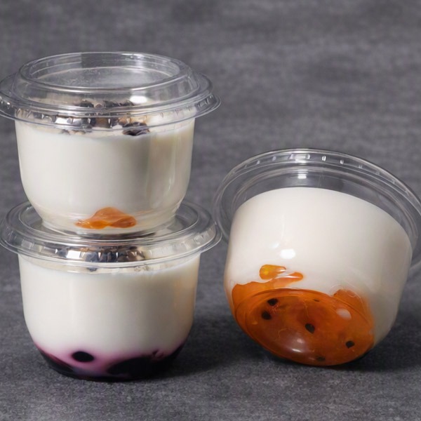 Panna cotta dessert with cherries or passion fruit
