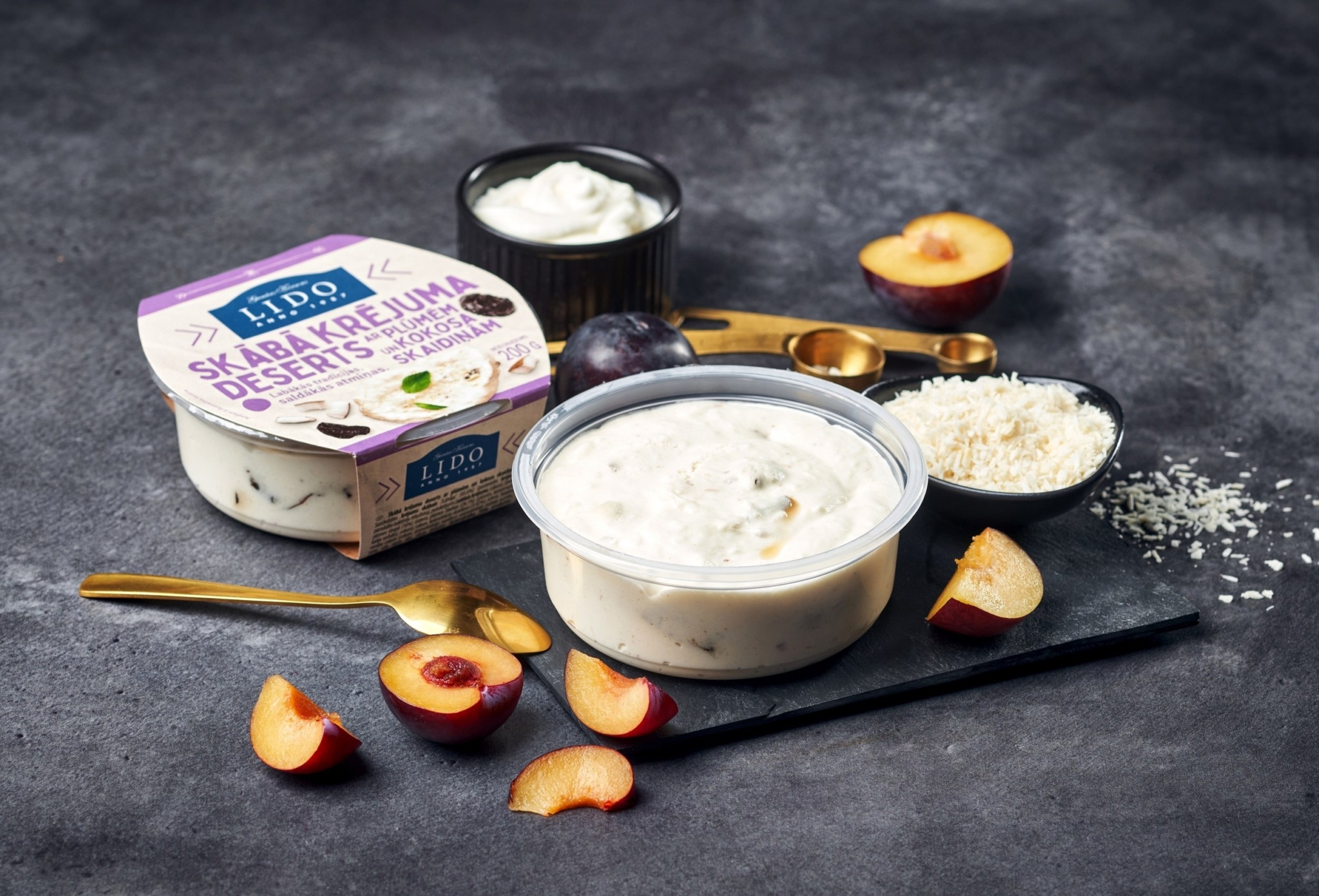 Sour cream dessert with prunes and shredded coconut